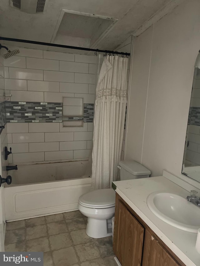 bathroom with visible vents, shower / tub combo with curtain, vanity, and toilet