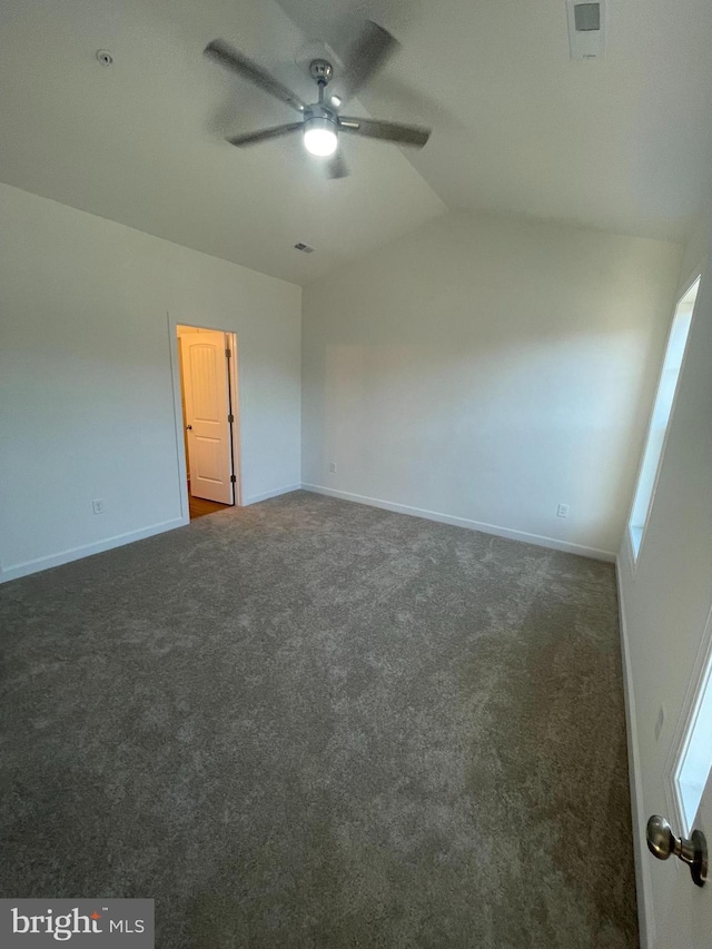 unfurnished bedroom with carpet floors, lofted ceiling, visible vents, and baseboards