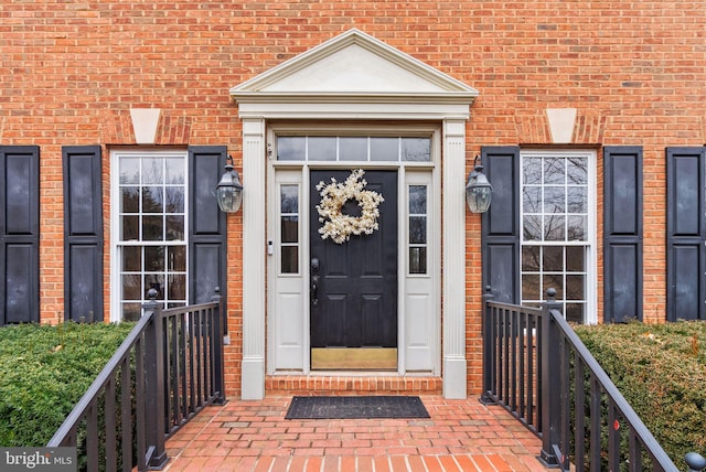 entrance to property with brick siding