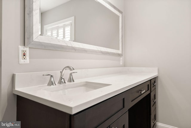 bathroom featuring vanity and baseboards