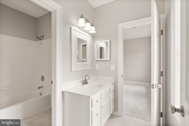 bathroom featuring  shower combination, vanity, and tile patterned floors