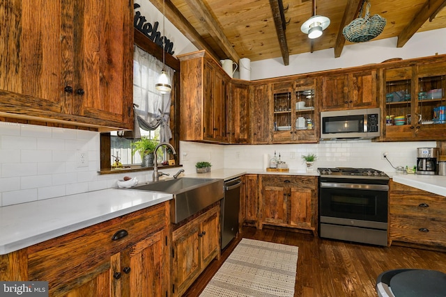 kitchen featuring dark wood finished floors, wooden ceiling, glass insert cabinets, appliances with stainless steel finishes, and a sink