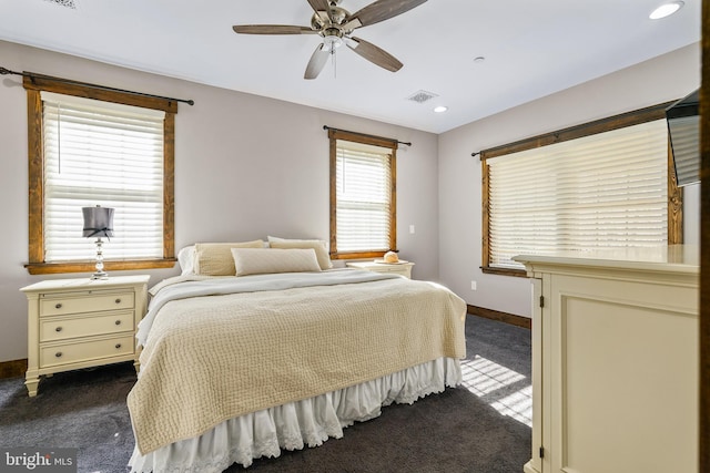 bedroom with recessed lighting, a ceiling fan, visible vents, baseboards, and dark colored carpet