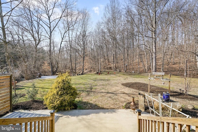 view of yard with a wooded view