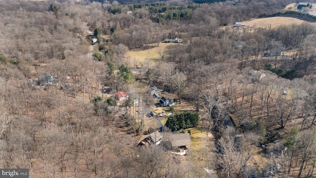 aerial view with a wooded view