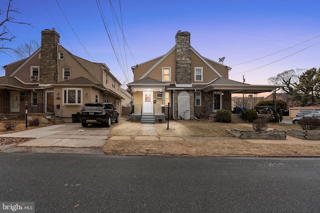 view of front of home featuring a chimney