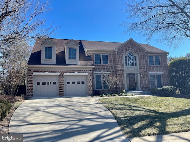 view of front facade featuring a garage, brick siding, a shingled roof, concrete driveway, and a front yard