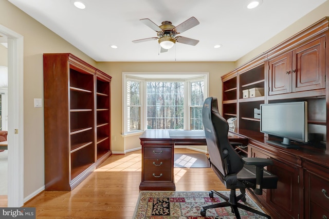 office area with a ceiling fan, light wood-type flooring, baseboards, and recessed lighting