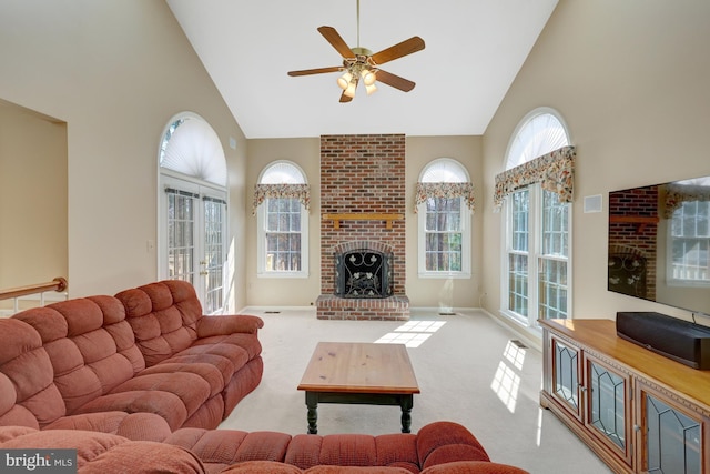 living area with carpet floors, a fireplace, high vaulted ceiling, and baseboards