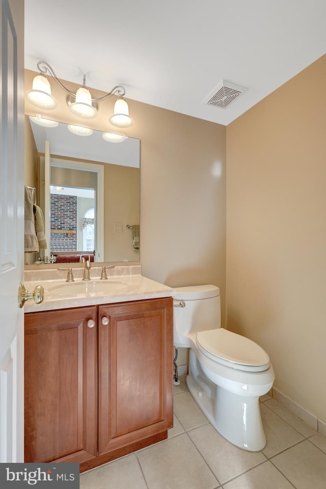 half bath featuring toilet, tile patterned flooring, visible vents, and vanity