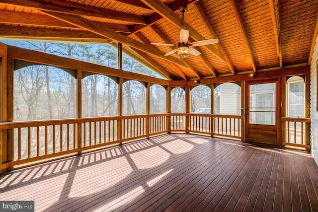 unfurnished sunroom featuring lofted ceiling with beams and ceiling fan