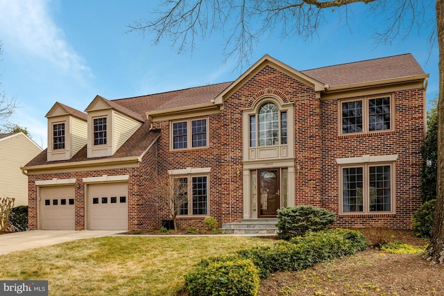 view of front of home with a garage, brick siding, driveway, and a front lawn