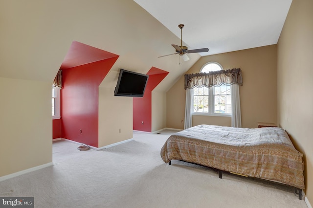 bedroom with carpet floors, lofted ceiling, ceiling fan, and baseboards