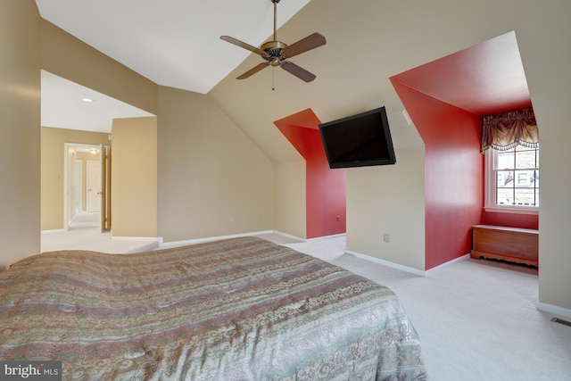 bedroom with lofted ceiling, carpet floors, and baseboards