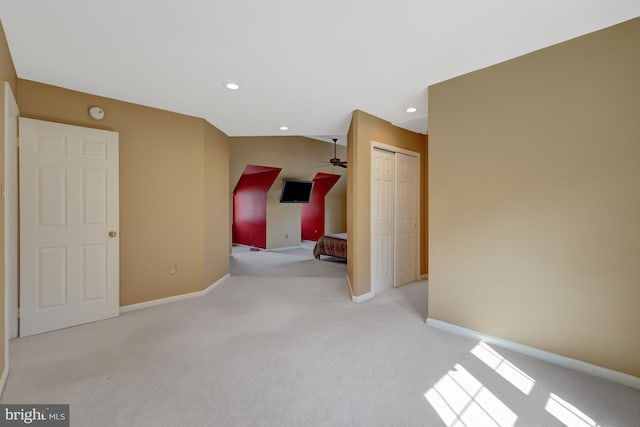 empty room with light carpet, baseboards, a ceiling fan, and recessed lighting