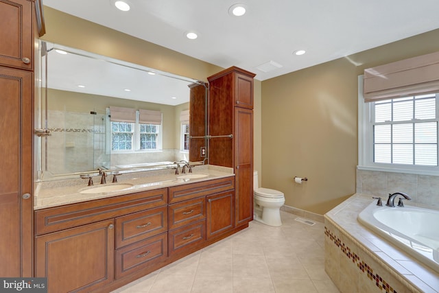 full bathroom with tile patterned flooring, visible vents, a sink, and a bath