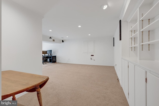 interior space with baseboards, recessed lighting, and light colored carpet