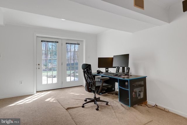 carpeted home office with crown molding and baseboards