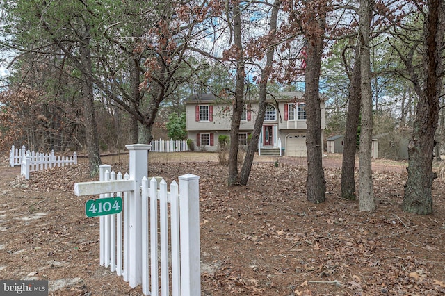 view of front of house with fence