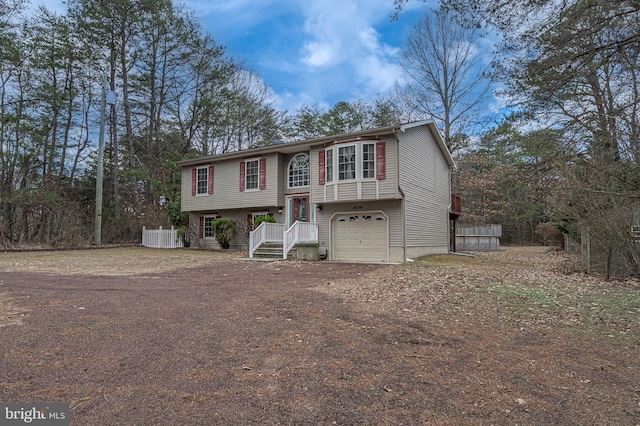 split foyer home featuring driveway and an attached garage