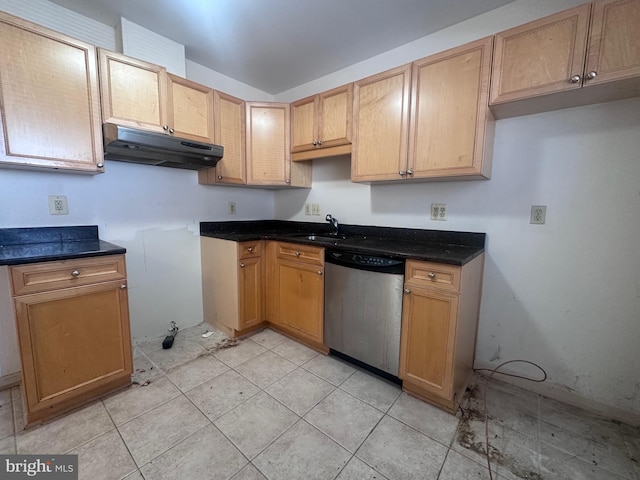 kitchen featuring a sink, under cabinet range hood, light tile patterned floors, and dishwasher