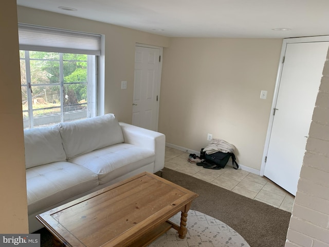 2807 S Grant St, Arlington, VA 22202 - living room featuring light tile patterned floors, light colored carpet, and baseboards
