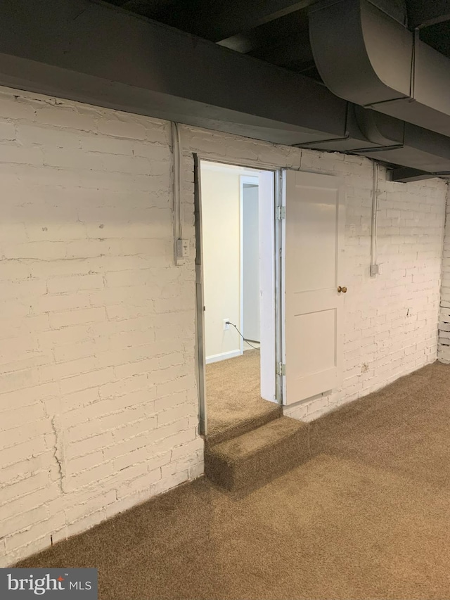 2807 S Grant St, Arlington, VA 22202 - basement with brick wall and carpet flooring