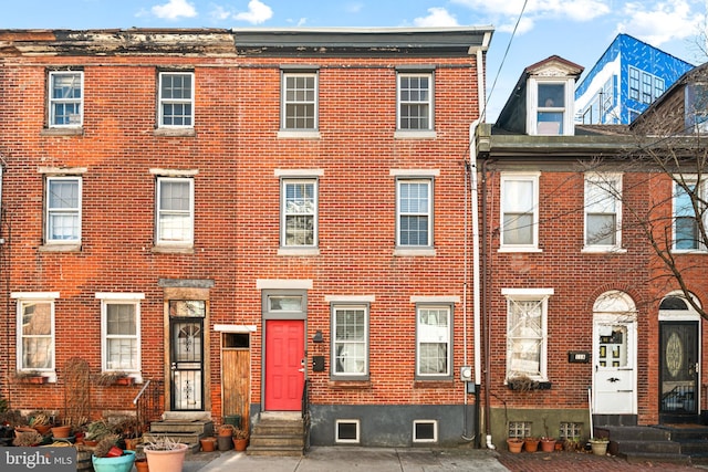 multi unit property with entry steps and brick siding