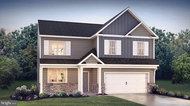 view of front of property featuring a garage, concrete driveway, stone siding, board and batten siding, and a front yard