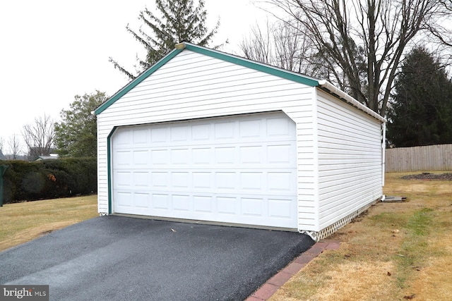 detached garage with fence