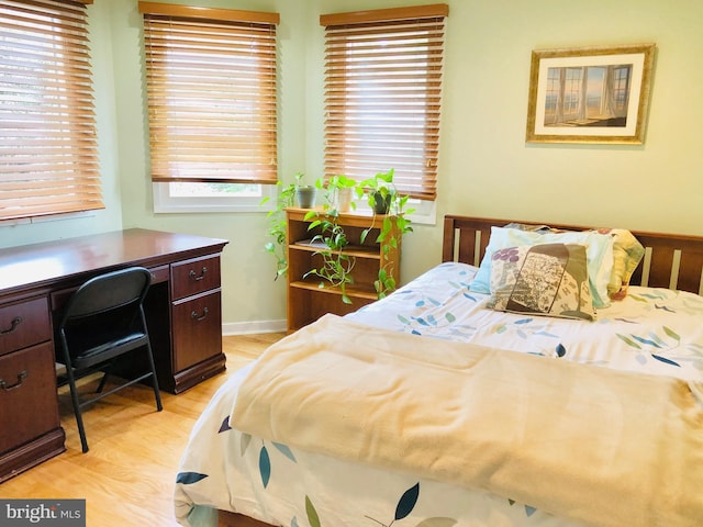 bedroom with light wood-type flooring