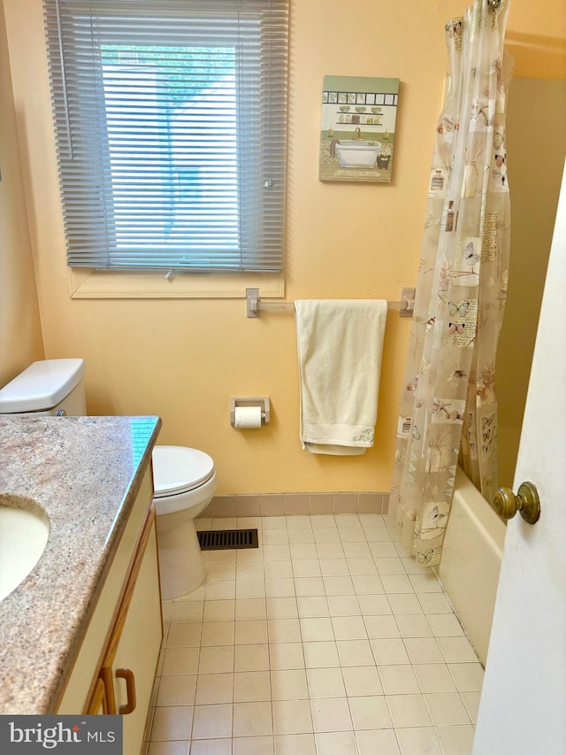 full bathroom with toilet, visible vents, vanity, tile patterned floors, and shower / bath combo