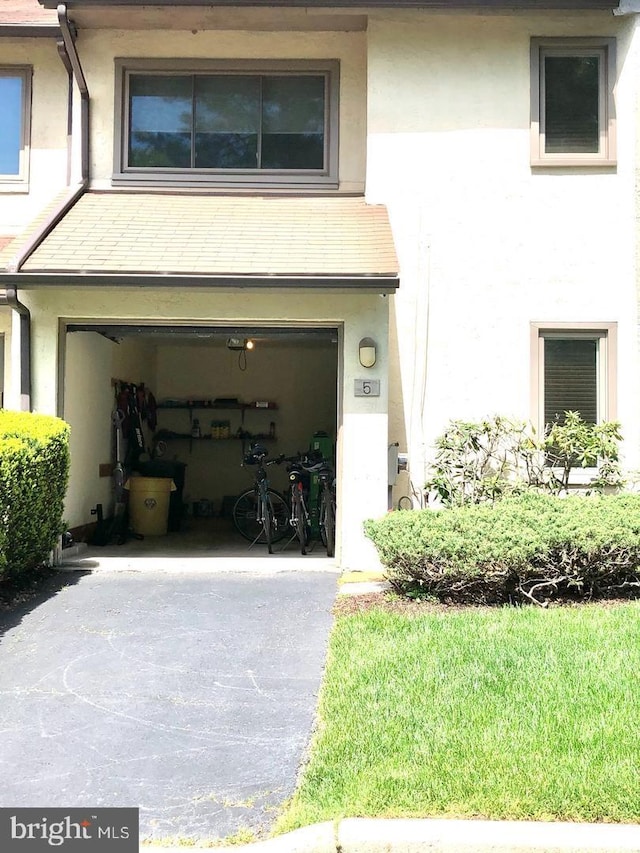 garage featuring driveway