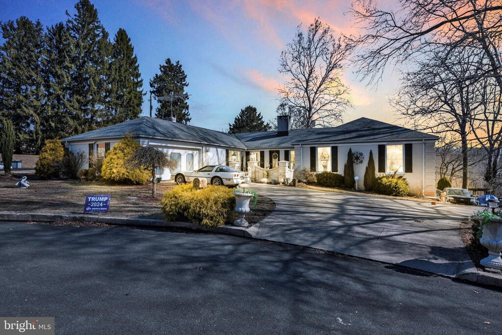5 Heather Ct, Reading, PA 19606 - view of front of home featuring driveway and a chimney