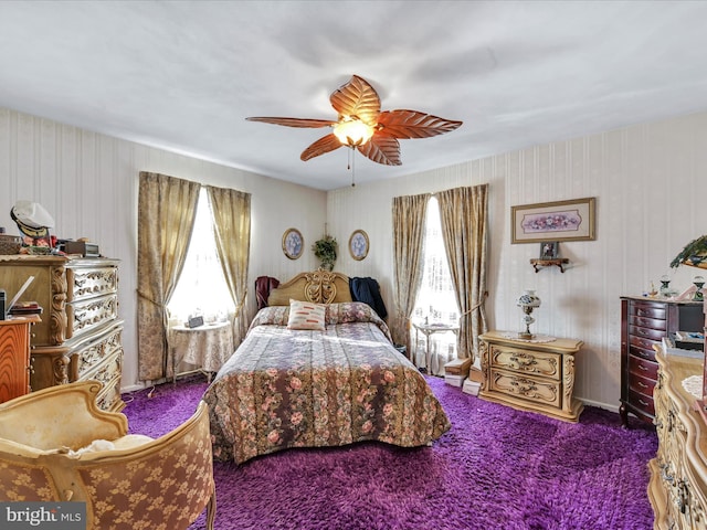 bedroom featuring multiple windows, ceiling fan, and carpet flooring