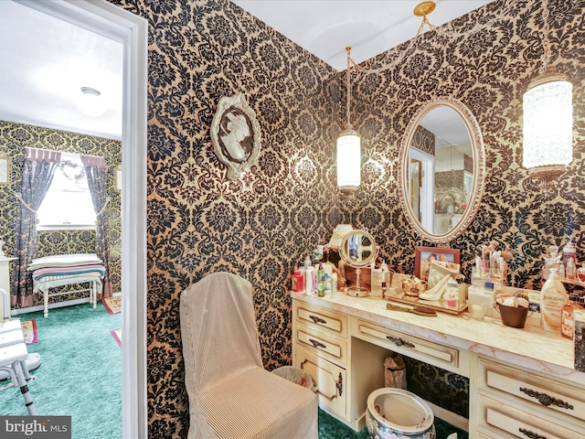 bathroom with wallpapered walls