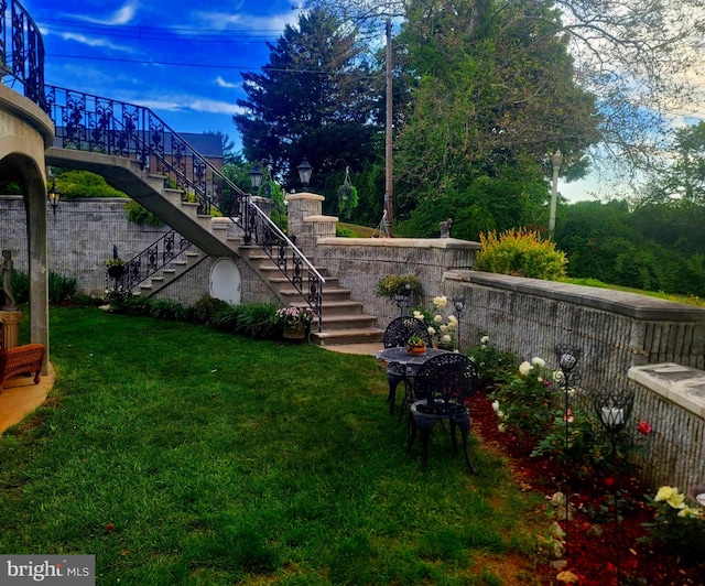 view of yard featuring stairway