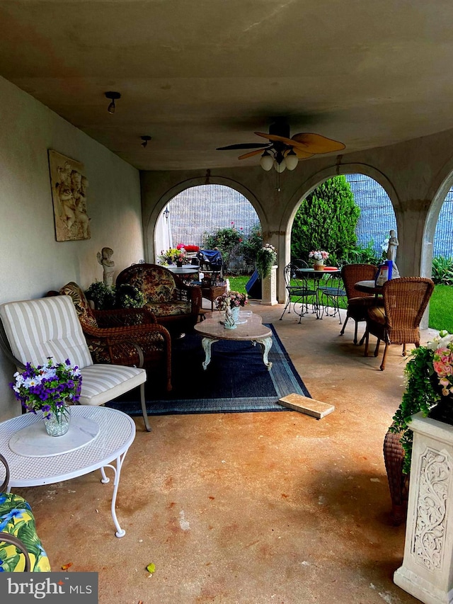 view of patio / terrace with an outdoor living space and a ceiling fan