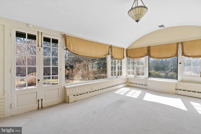 unfurnished sunroom with a baseboard heating unit, visible vents, and vaulted ceiling