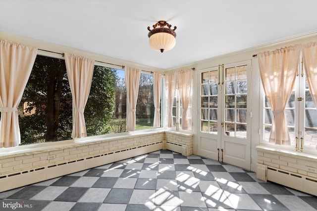 unfurnished sunroom with a baseboard radiator