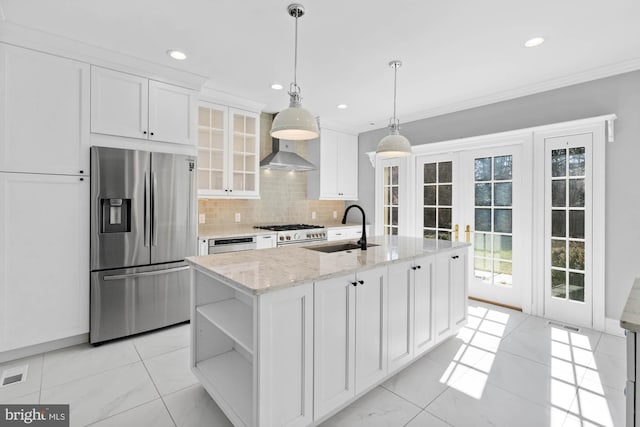 kitchen featuring crown molding, stainless steel refrigerator with ice dispenser, decorative backsplash, white cabinets, and a sink