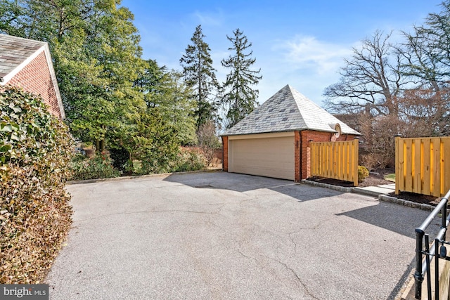 detached garage with fence