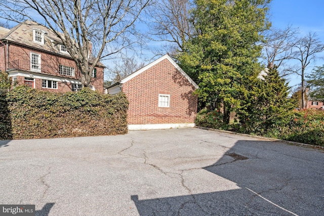 exterior space with brick siding