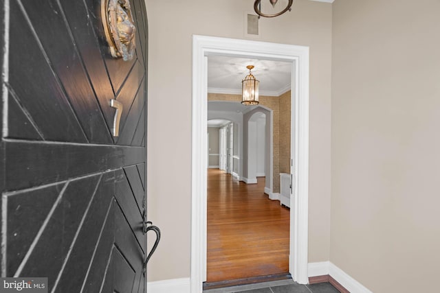 view of exterior entry featuring french doors and visible vents