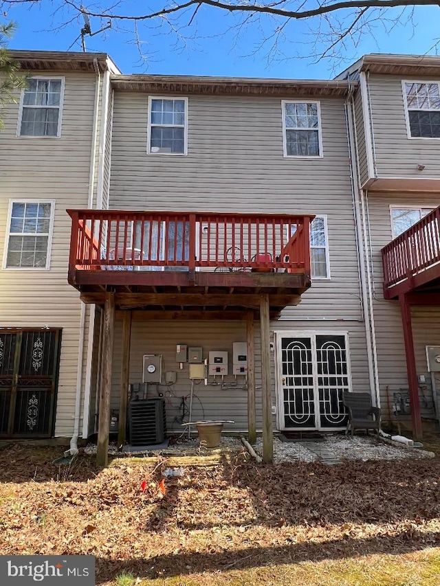 back of house featuring central AC