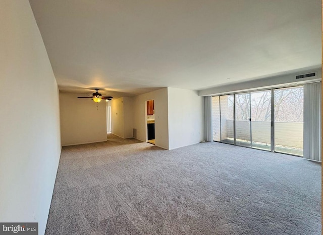 unfurnished living room with a ceiling fan, light carpet, and visible vents