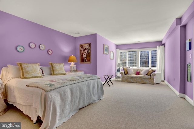 carpeted bedroom with baseboards