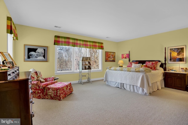 bedroom with visible vents, baseboards, and carpet