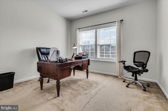 home office featuring carpet flooring, baseboards, and visible vents