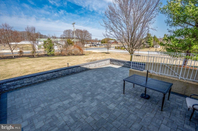 view of patio / terrace featuring fence